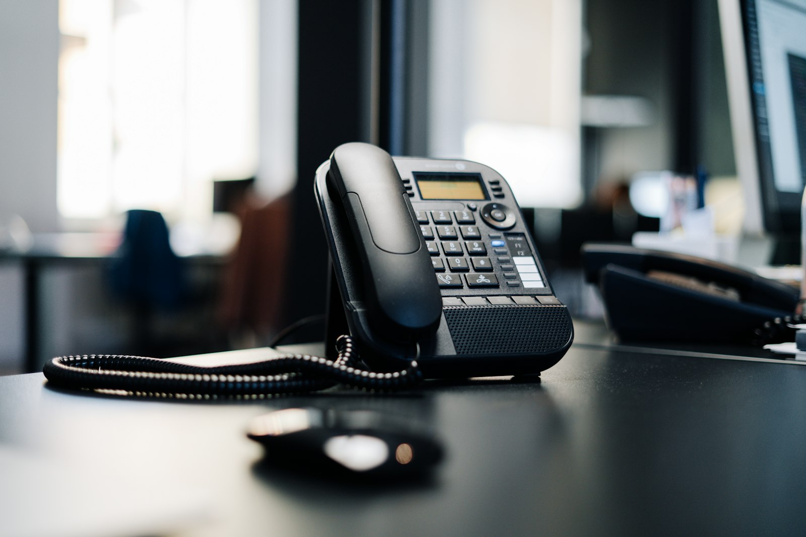 Business desk phone used in a modern office phone system.